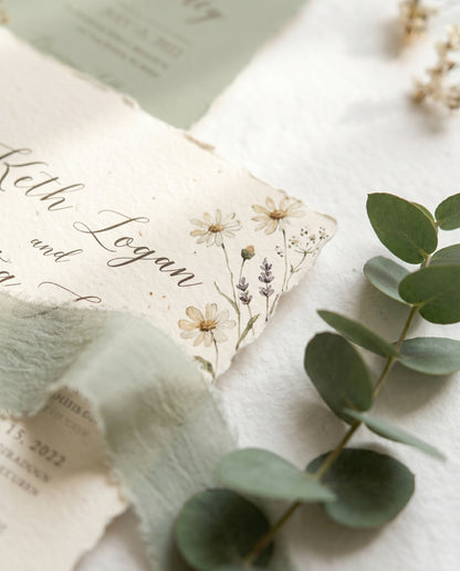 Wildflower wedding invitation card close-up detail, sage and cream watercolor